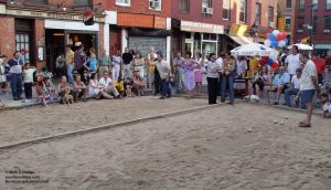 Bastille Day on Smith Street with Petanque tournament on courts made of sand filling the street curb-to-curb in front of Patois. ©Mark D Phillips