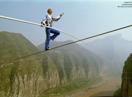Jay Cochrane, "The Prince of the Air", completes The Great China Skywalk over the Yangtze River in Qutang Gorge, China, on October 28, 1995. The skywalk was and is the greatest ever made spanning half a mile between the canyon walls and 1,340 feet above the river. ©Mark D Phillips