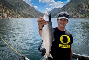 Colorado June 24, 2021: Chuck Bigger nephew Gabe Chambless holds a Kokanee Salmon on Morrow Point Reservoir. ©Chuck Bigger