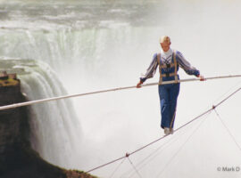 Jay Cochrane skywalks on Clifton Hill in Niagara Falls, Canada, in 2002. The first skywalk in over a hundred years went from the pinnacle of the Sheraton on the Falls Hotel to the Casino Niagara Tower at a height of 40 stories, with Niagara Falls as the backdrop. "Skywalk at Niagara" was the highest skywalk ever completed in Niagara Falls. PHOTO BY MARK D. PHILLIPS