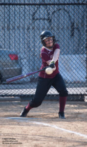 Eliza Phillips bats at Packer Softball Middle School game at Red Hook Fields in Brooklyn, NY. ©Mark D Phillips