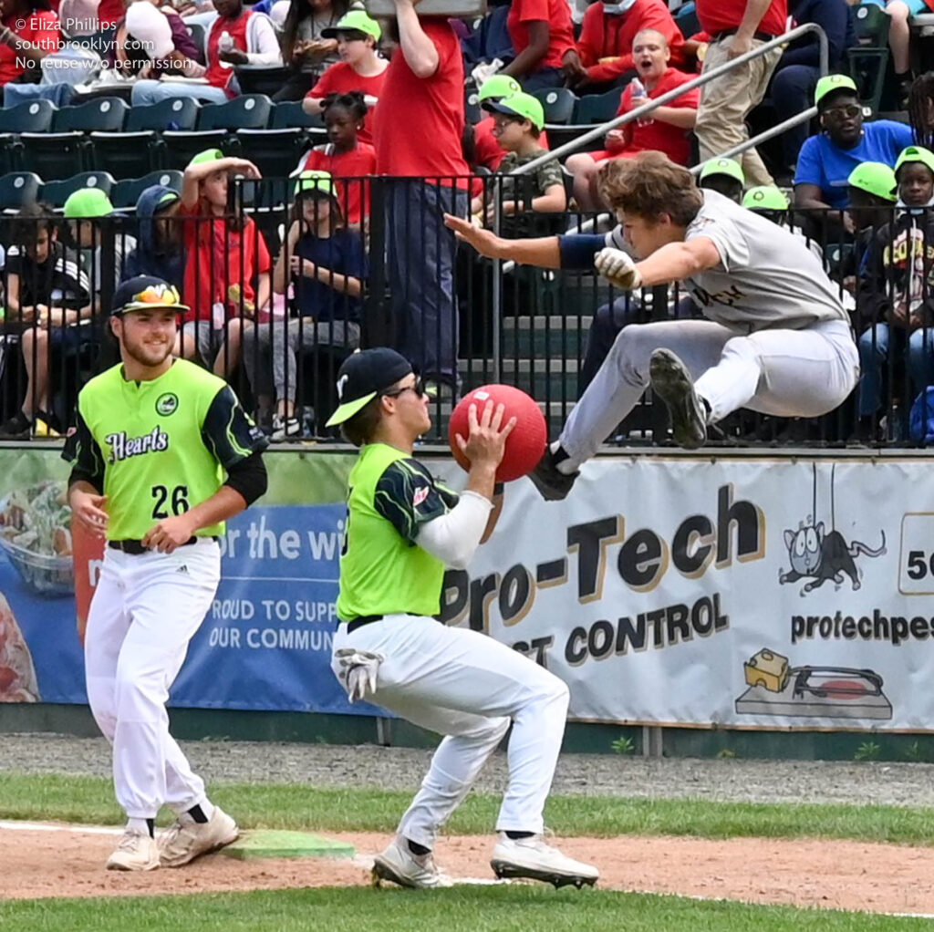 Worcester Bravehearts Andrew Chronister (36), Nate Novia (26) watch teammate Connor Peek tag out Norwich Sea Unicorns Zach Zyons during the kickball inning of the fan rules game on June 8, 2022.
