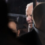 President Joe Biden arrives into a bullet -proof glass box at the opening ceremony. ©Mark D Phillips