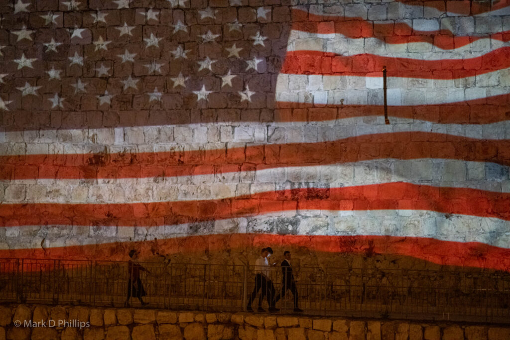 The American and Israeli flags were projected on the outside wall of the old city of Jerusalem, welcoming President Biden to the country. ©Mark D Phillips