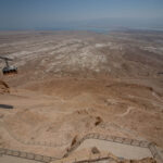 A cable car moves up the side of Masada with the Dead Sea in the distance in Israel 2022 ©Mark D Phillips.