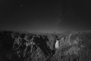 Light from a rising gibbous moon shot down the Grand Canyon of the Yellowstone helping illuminate the Lower Falls and the canyon itself. ©Stan Honda