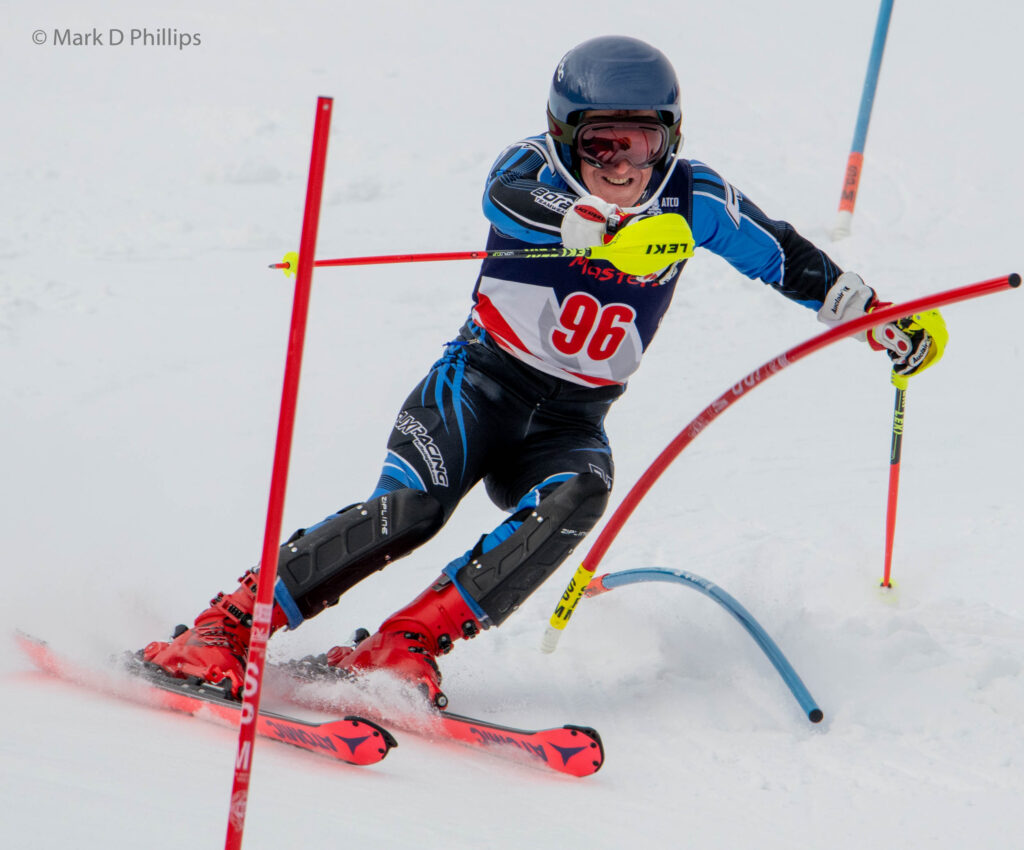 Jim Tomassetti attacks the gates in the USSA Masters Eastern Championship Slalom at West Mountain on February 20, 2022. ©Mark D Phillips