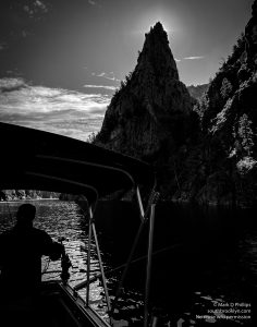 Early morning sun gives a dramatic effect to the Curecanti Needle from our fishing boat on Morrow Point Reservoir on June 20, 2023. ©Mark D Phillips