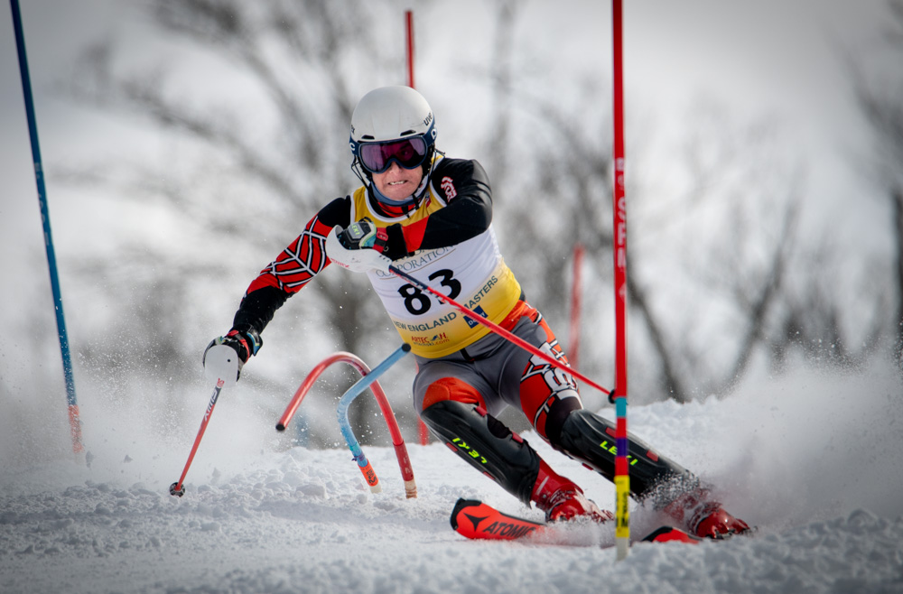 Scott Reichhelm pushes through gates during the New England Masters Slalom Race at Whaleback Mountain on March 10, 2023. ©Mark D Phillips